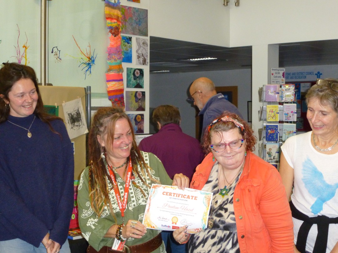 A creative participant receives a certificate for completing a course.