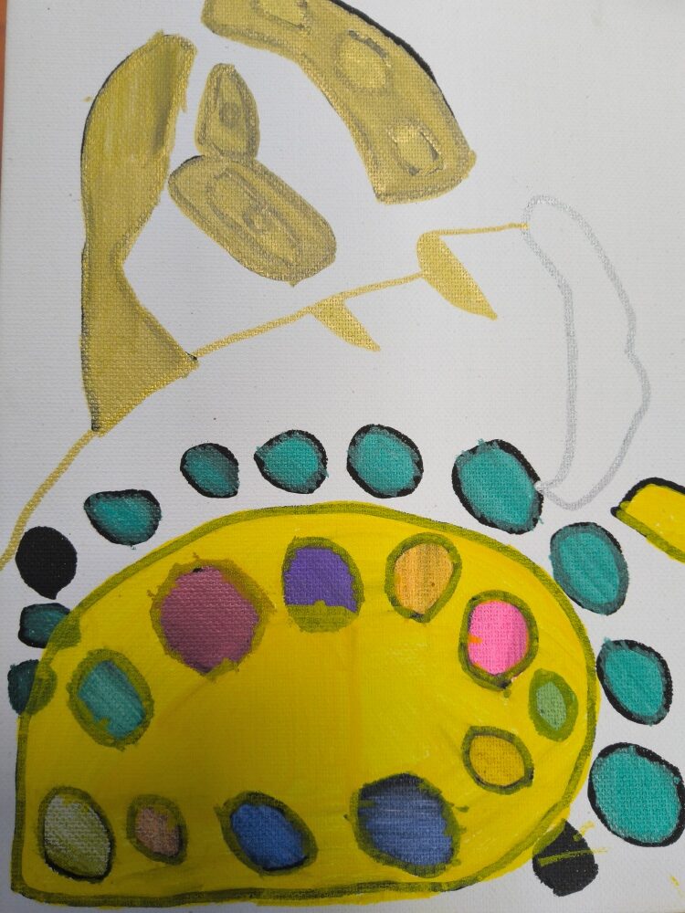A decorative pattern of yellow, pink, gold and green and blue circles and lines