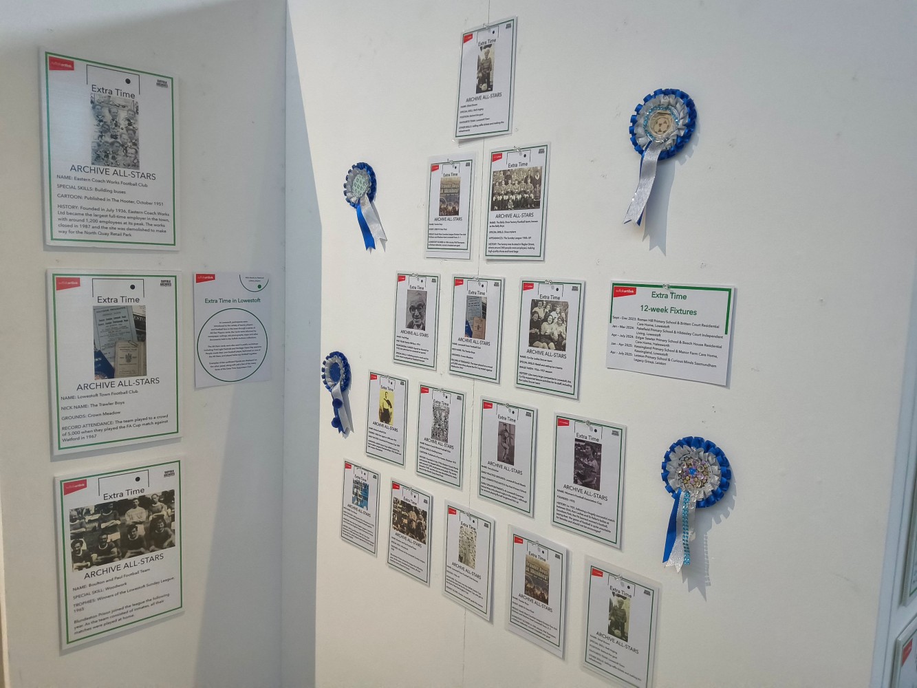 White panels display 4 blue and white rosettes and a series of cards with images and text