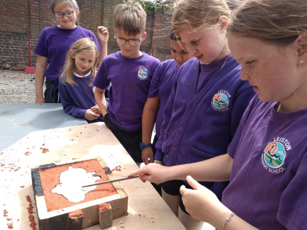 Pupils tap the pewter, to see if it’s ‘cooked’ enough.