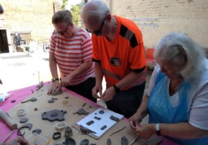 Participants making engine part clay slabs