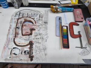 Finished drawing of a clamp next to the physical clamp