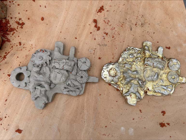 The clay mould on the left and the pewter cast on the right