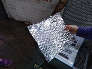 Foil impression made by rubbing it over a grate