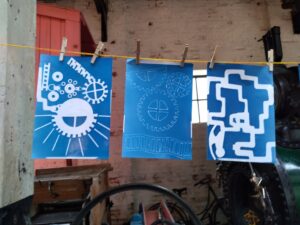 3 cyanotypes on line drying