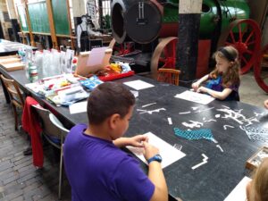 3 pupils preparing cyanotype designs