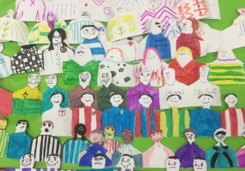 Rows of brightly coloured paper football fans