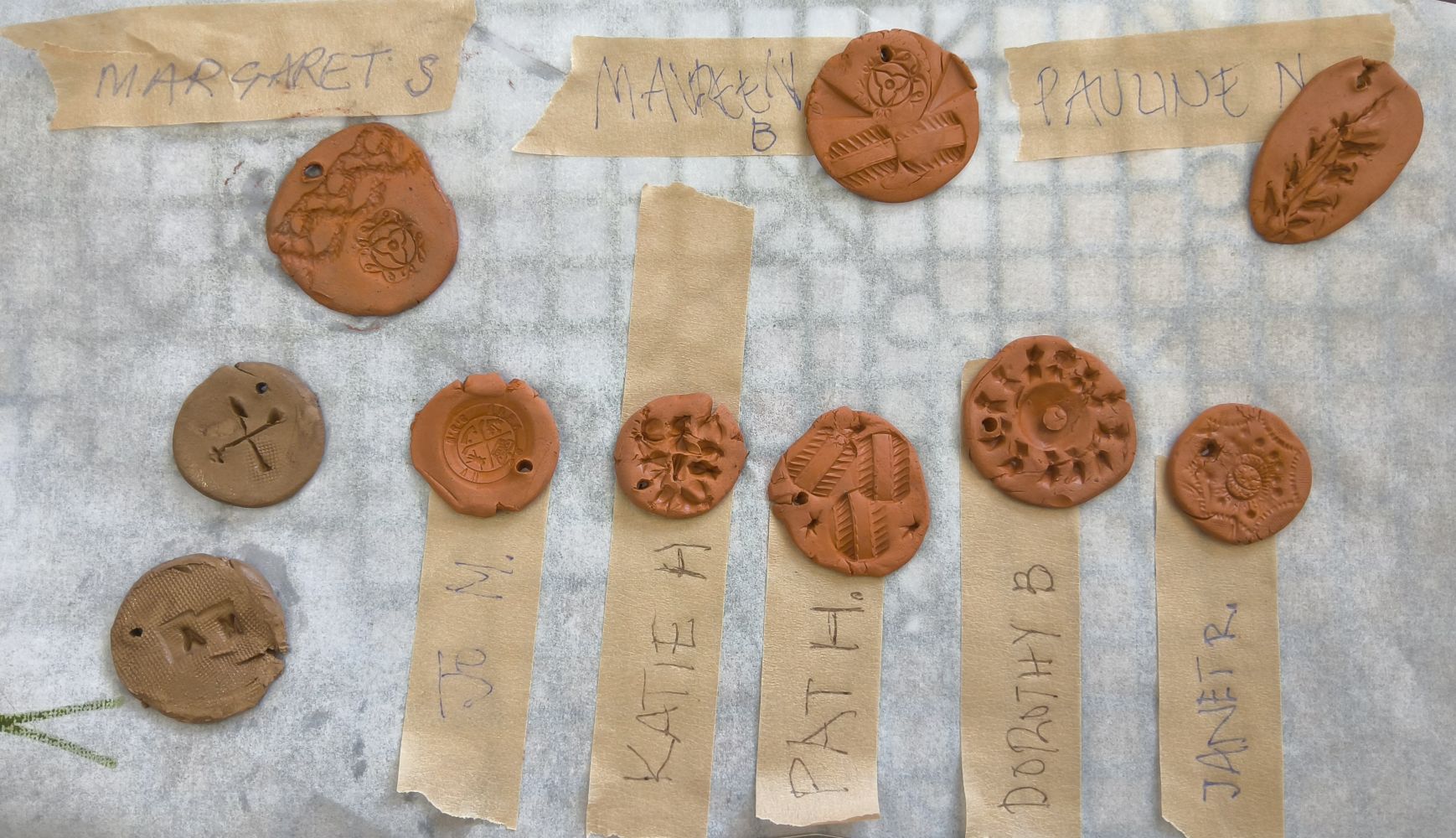 10 metal clay discs ready for firing