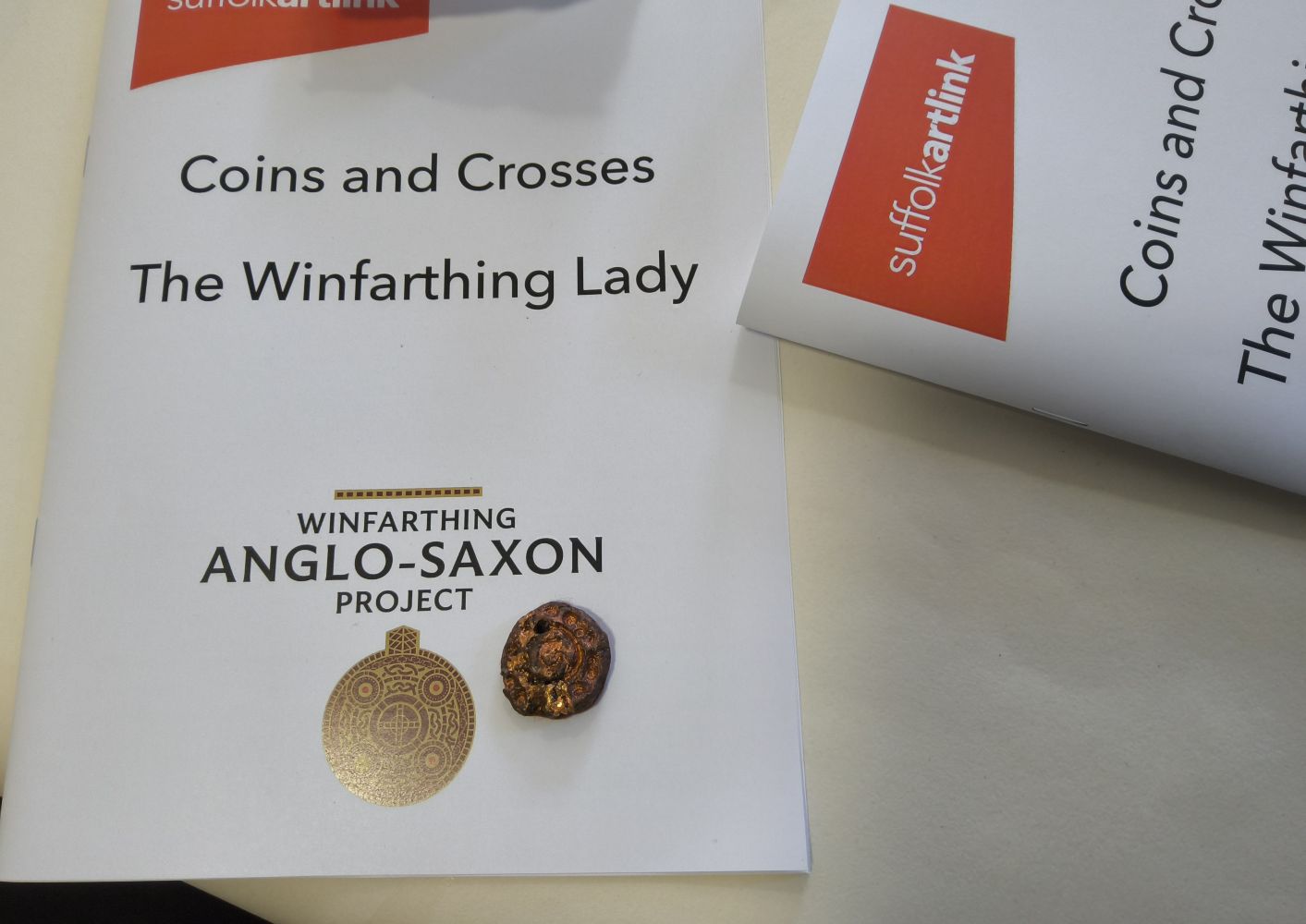 Suffolk Artlink. Coins and Crosses. The Winfarthing Lady. Winfarthing Anglo-Saxon Project. A small copper disc